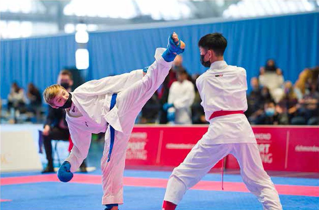 A competitor misses a high kick at the 2021 Canada Open Karate Championship